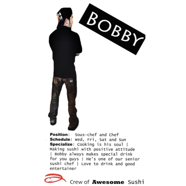 Bobby, a chef from Awesome Sushi, stands with his back to the viewer, wearing a black shirt and cap.